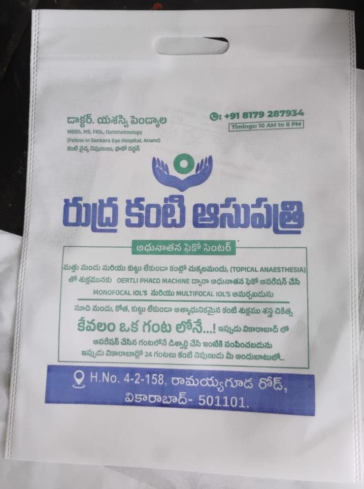Non-woven D-cut bag for Rudra Eye Hospital with Telugu and English print