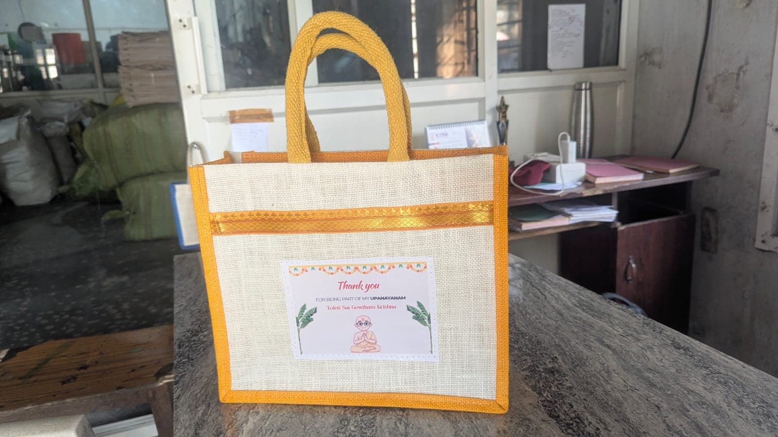 Jute return-gift bag with yellow trim — Upanayanam thank-you print